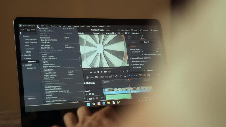 Laptop displaying video editing software interface for cinematic storytelling.