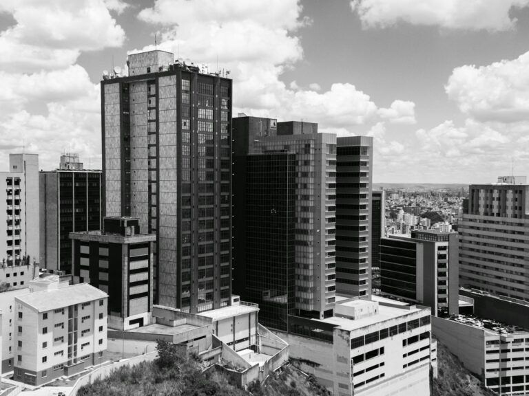 Dramatic black and white photograph capturing the urban skyline of Belo Horizonte, Brazil.