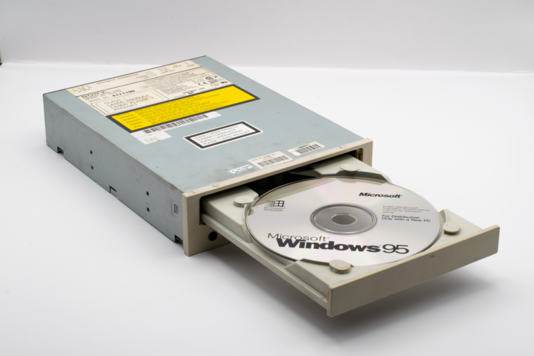 Vintage CD-ROM drive featuring Microsoft Windows 95 installation CD, a blast from the computing past.