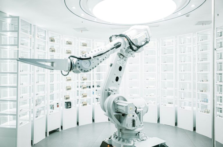 white robotic arm in display showroom